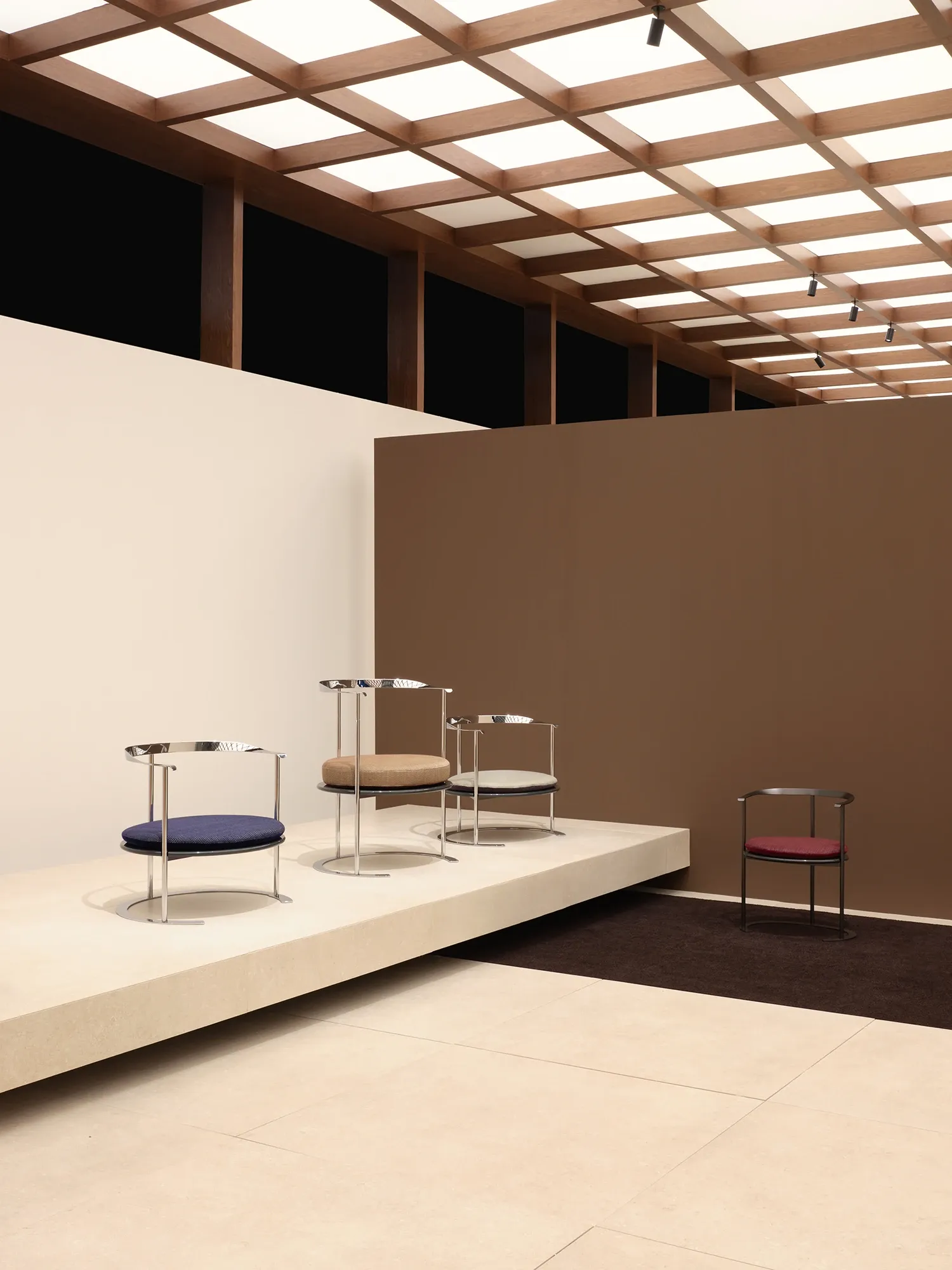 Haus Nuller textile cushion for the Catilina chair displayed on a stand by Formafantasma.