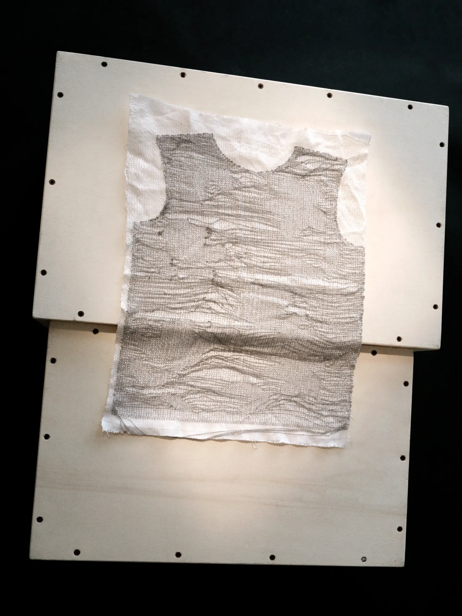Haus Nuller Collection N1 textile panel with woven chain detail.
